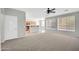 Bright living room featuring an open concept design to the kitchen and great natural light from the large windows at 2605 W Darrel Rd, Phoenix, AZ 85041