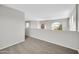 Loft area featuring neutral walls and carpet, plus views to the outside at 2605 W Darrel Rd, Phoenix, AZ 85041