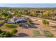 Expansive backyard features a pool, covered patio, and a sports court for entertainment and recreation at 2661 E Birchwood Pl, Chandler, AZ 85249