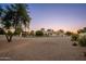 Extensive backyard with desert landscaping and mature trees, providing a peaceful and private setting at 2661 E Birchwood Pl, Chandler, AZ 85249
