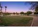 Lush backyard featuring a well-maintained lawn and desert landscaping, ideal for outdoor enjoyment at 2661 E Birchwood Pl, Chandler, AZ 85249