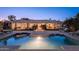 An inviting backyard with a pool, ample seating, and lush greenery perfect for outdoor entertaining at 2661 E Birchwood Pl, Chandler, AZ 85249