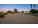 Large backyard with gravel ground cover and lush green grass offers a versatile outdoor space at 2661 E Birchwood Pl, Chandler, AZ 85249