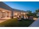 Lush backyard with patio, outdoor seating, and manicured lawn at 2661 E Birchwood Pl, Chandler, AZ 85249