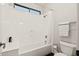 Bright bathroom featuring a combination tub and shower with white surround and neutral wall color at 2661 E Birchwood Pl, Chandler, AZ 85249