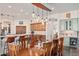 Elegant dining space showcases custom cabinets, stylish pendant lights, and a cozy breakfast bar at 2661 E Birchwood Pl, Chandler, AZ 85249