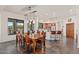 Open dining area features a table for eight, designer lighting, and easy access to the backyard at 2661 E Birchwood Pl, Chandler, AZ 85249