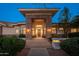 Grand front entry with decorative stone accents and ample lighting at 2661 E Birchwood Pl, Chandler, AZ 85249