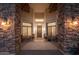 Covered front porch with stone columns and decorative welcome decor at 2661 E Birchwood Pl, Chandler, AZ 85249