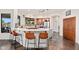 Modern kitchen with stainless steel appliances, a center island, and a breakfast bar for casual dining at 2661 E Birchwood Pl, Chandler, AZ 85249