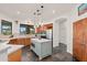 Well-equipped kitchen featuring a center island, stainless appliances, and convenient access to the dining area at 2661 E Birchwood Pl, Chandler, AZ 85249