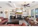 Cozy living room with a beautiful stone fireplace and built-in shelving at 2661 E Birchwood Pl, Chandler, AZ 85249