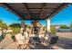 Cozy outdoor fireplace with comfortable seating, ideal for relaxing and entertaining at 2661 E Birchwood Pl, Chandler, AZ 85249