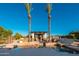 Stunning pool area with tall palm trees and an outdoor cabana at 2661 E Birchwood Pl, Chandler, AZ 85249