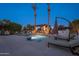 Beautiful pool area with stone accents, a pergola, and lounge chairs at 2661 E Birchwood Pl, Chandler, AZ 85249