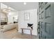 Welcoming entryway features a wooden bench, modern decor, and bright, open access to the living area at 2949 N 29Th St, Phoenix, AZ 85016