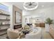 Inviting living room features a fireplace, modern lighting, and open access to the dining area and kitchen at 2949 N 29Th St, Phoenix, AZ 85016