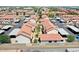 Extensive aerial view captures an expansive complex with terracotta roofs, parking, and serene greenery at 2954 N Oregon St # 6, Chandler, AZ 85225