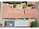 A complex showcasing well-maintained terracotta rooftops, manicured landscaping, and ample parking at 2954 N Oregon St # 6, Chandler, AZ 85225