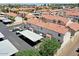 Aerial view of townhomes showcasing terracotta roofs, assigned parking, and community landscaping at 2954 N Oregon St # 6, Chandler, AZ 85225