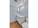 Bathroom with white cabinets, tile flooring, and updated toilet at 2954 N Oregon St # 6, Chandler, AZ 85225
