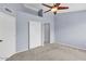 Bedroom featuring a ceiling fan and closet doors at 2954 N Oregon St # 6, Chandler, AZ 85225