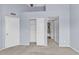 Bedroom features neutral carpet, closets, and ensuite bathroom at 2954 N Oregon St # 6, Chandler, AZ 85225