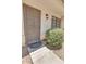 Inviting entrance with secure iron door, and manicured green bushes, enhancing curb appeal at 2954 N Oregon St # 6, Chandler, AZ 85225