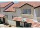 Charming townhome featuring a red tile roof, stucco siding, and well-maintained landscaping at 2954 N Oregon St # 6, Chandler, AZ 85225