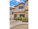 Charming townhome with a terra cotta tiled roof, secure front door, and well-maintained landscaping at 2954 N Oregon St # 6, Chandler, AZ 85225