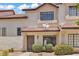 Inviting front entrance with a well-maintained yard, decorative shrubs, and a covered entryway at 2954 N Oregon St # 6, Chandler, AZ 85225