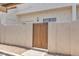 Back gate providing secure access to the property, framed by stucco walls and desert landscaping at 2954 N Oregon St # 6, Chandler, AZ 85225