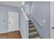 Hallway staircase with tile flooring at the bottom and carpeted steps leading to the upper level at 2954 N Oregon St # 6, Chandler, AZ 85225
