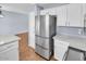 Open kitchen featuring stainless steel refrigerator and quartz countertops at 2954 N Oregon St # 6, Chandler, AZ 85225