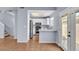 Bright kitchen with stainless steel refrigerator, white cabinets, and quartz countertops at 2954 N Oregon St # 6, Chandler, AZ 85225