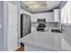 Modern kitchen with stainless steel appliances, white cabinets, and quartz countertops at 2954 N Oregon St # 6, Chandler, AZ 85225
