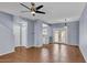 Living room area with back patio access, ceiling fan, and staircase at 2954 N Oregon St # 6, Chandler, AZ 85225