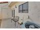 Back patio with chairs, a sliding door, and an air conditioning unit at 2954 N Oregon St # 6, Chandler, AZ 85225