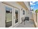 Private back patio with French doors, room for seating, and potted plants, creating an inviting outdoor space at 2954 N Oregon St # 6, Chandler, AZ 85225