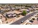 An aerial view showcases this charming home nestled in a vibrant community with well-maintained landscaping at 3022 E Santa Fe Ln, Gilbert, AZ 85297
