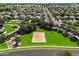 Aerial view of the community showcasing tree-lined streets, lush green spaces, and beautiful homes at 3022 E Santa Fe Ln, Gilbert, AZ 85297