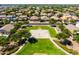 Aerial view of community basketball court surrounded by tree-lined streets and beautiful homes at 3022 E Santa Fe Ln, Gilbert, AZ 85297