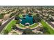 Aerial view of the community park featuring a tranquil pond, gazebo, community center, and lush landscaping at 3022 E Santa Fe Ln, Gilbert, AZ 85297