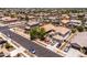 Overhead view of the home featuring manicured lawn and mature trees in a well-maintained suburban neighborhood at 3022 E Santa Fe Ln, Gilbert, AZ 85297