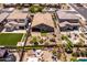 An aerial view of the property with manicured lawns and artful landscaping at 3022 E Santa Fe Ln, Gilbert, AZ 85297