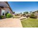 A beautiful landscaped backyard offers a relaxing retreat with lush greenery and desert-friendly plants at 3022 E Santa Fe Ln, Gilbert, AZ 85297