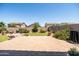 Landscaped backyard with patio and lawn, enclosed by a wall, perfect for entertaining or relaxing at 3022 E Santa Fe Ln, Gilbert, AZ 85297