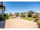 Landscaped backyard with patio and lawn, enclosed by a wall creating a private outdoor space at 3022 E Santa Fe Ln, Gilbert, AZ 85297