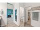 Bathroom view with vanity, toilet, and walk in closet featuring neutral walls and tile flooring at 3022 E Santa Fe Ln, Gilbert, AZ 85297