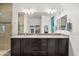 Luxurious bathroom featuring a double sink vanity, modern fixtures, and bright lighting at 3022 E Santa Fe Ln, Gilbert, AZ 85297